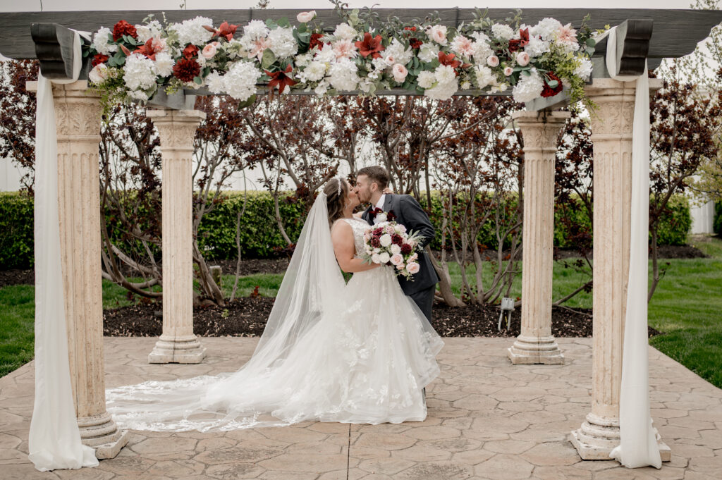 outdoor garden pergola wedding with florals