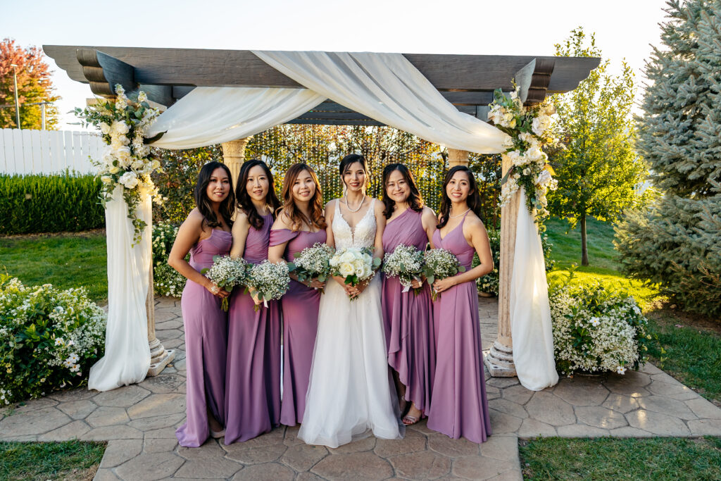 pergola with bridal flowers and drapery swags