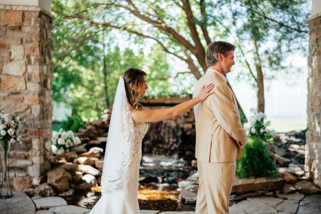 first look with bride & groom at waterfall in garden, covered patio, rain back up, plan b venue, in kansas city