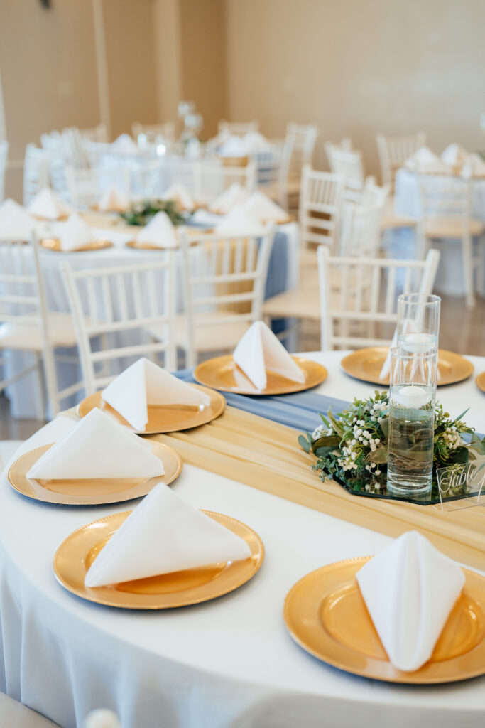 indoor temperature controlled wedding reception with table decor and centerpieces included, table runners, chiavari chairs, set up and take down included